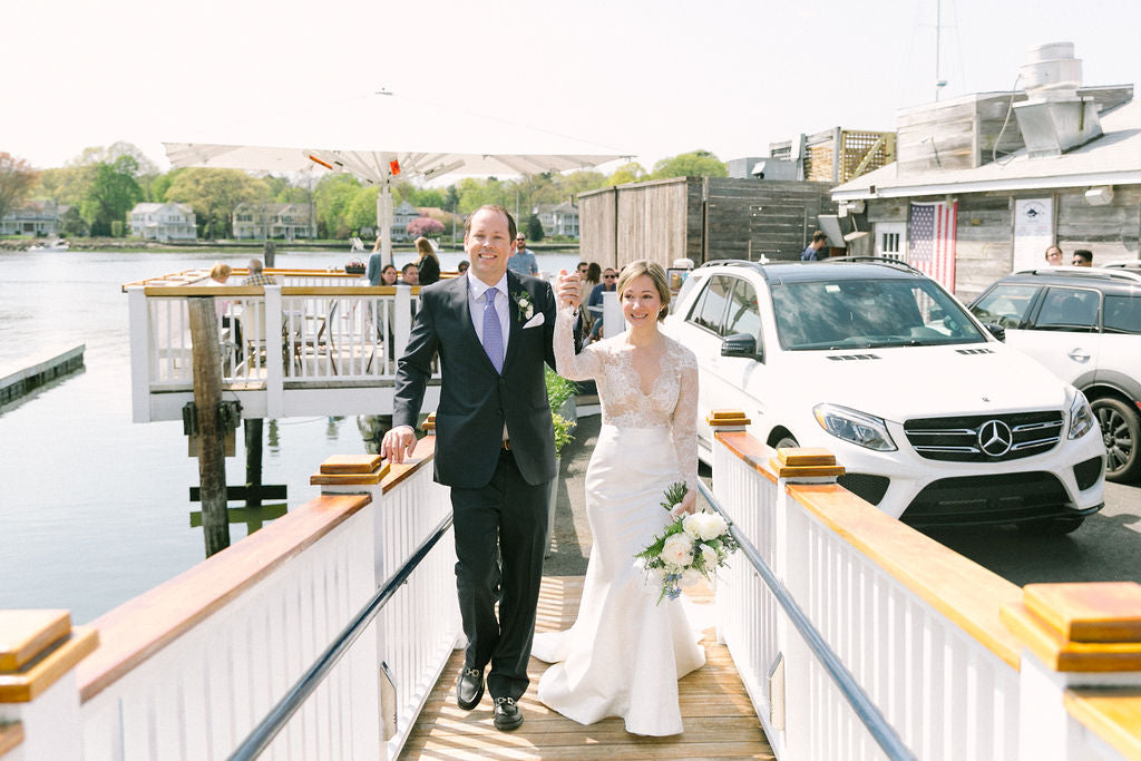 Wedding couple standing on a dock